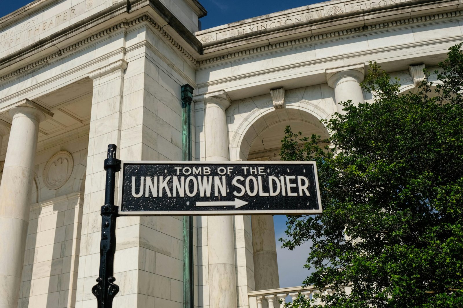 a black and white street sign in front of a building